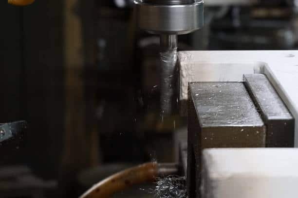 End mill cutting flat metal surface in CNC milling machine
