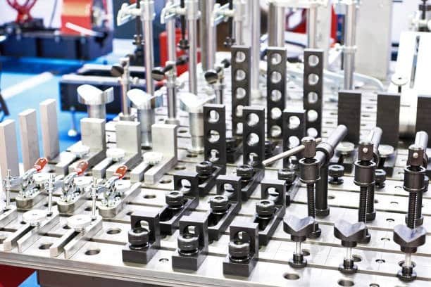 Complete modular CNC fixturing system with various clamps, stoppers, and alignment tools