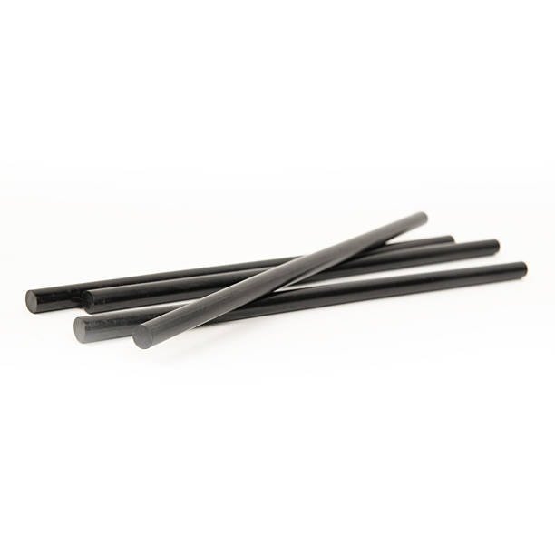 Black plastic rods in solid form before melting process