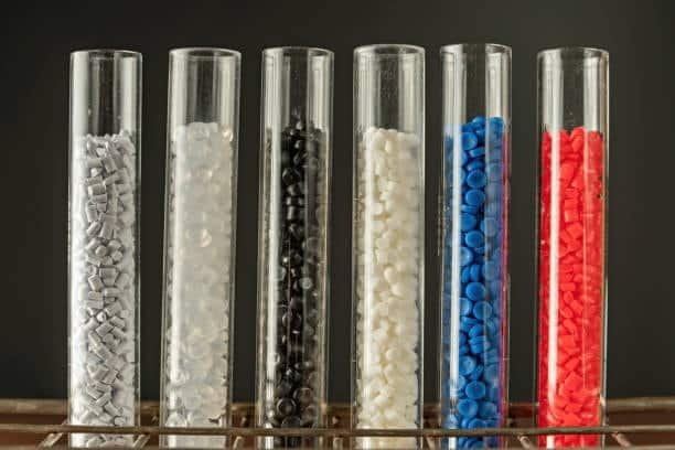 Plastic resin granules in test tubes including polyvinyl chloride (PVC) and polypropylene (PP) samples