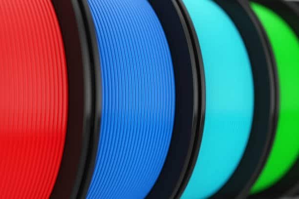 Multiple colored spools of polypropylene and polycarbonate filaments for 3D printing applications.