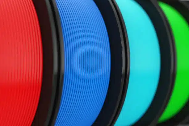 Multiple colored spools of polypropylene and polycarbonate filaments for 3D printing applications.