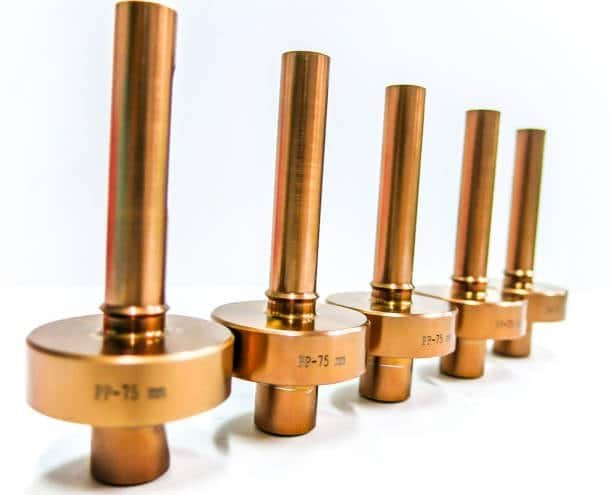 Line of metal shafts with press fit specifications engraved on each part