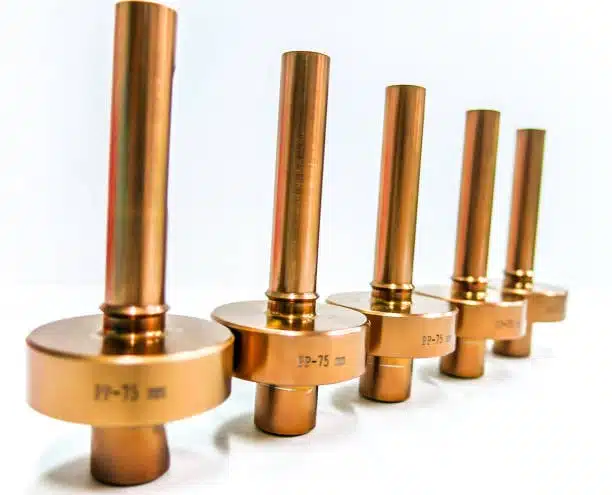 Line of metal shafts with press fit specifications engraved on each part