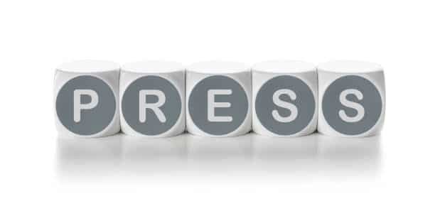 Cubes aligned to form the word PRESS, visually indicating press fit assembly metaphor