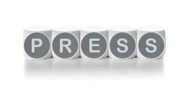 Cubes aligned to form the word PRESS, visually indicating press fit assembly metaphor