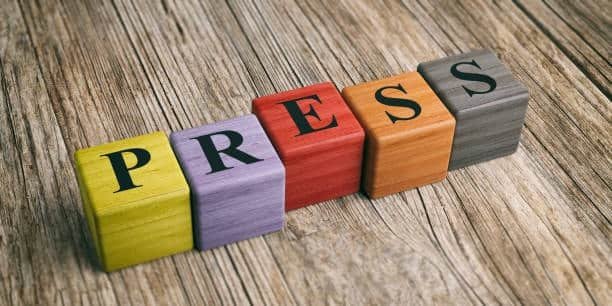 Word PRESS displayed on colored wooden blocks representing press fit terminology