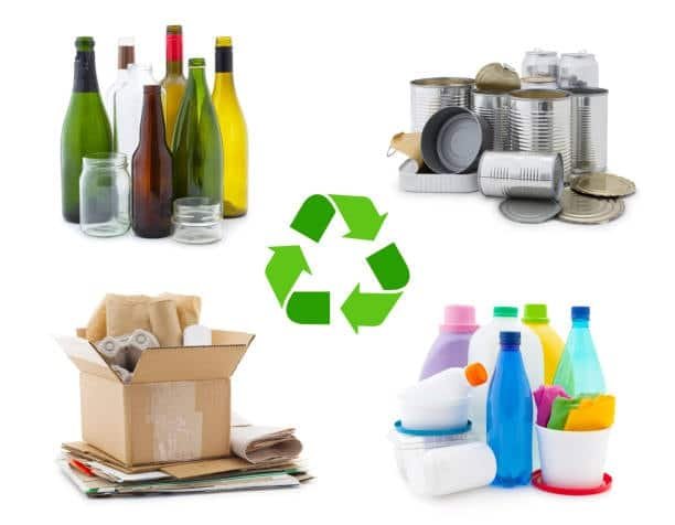 Grouped recyclable waste: cardboard, cans, bottles, and plastic containers with recycling symbol