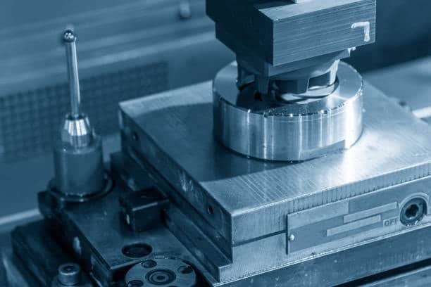 Close-up of a surface grinding machine with magnetic chuck and workpiece