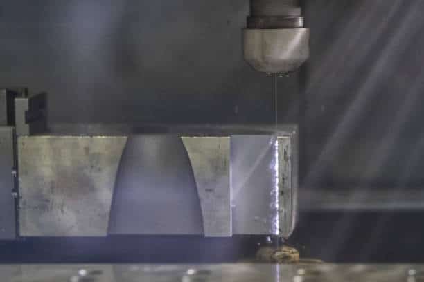 Wire EDM cutting a mold component with fixture alignment