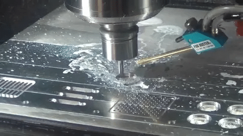 Standard 3-axis CNC milling process removing material from flat surface.