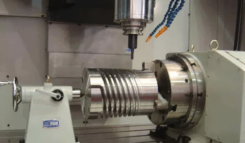 CNC machining operation for cutting grooves on large helical gear using 4-axis motion.