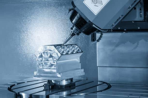 Engine block being milled with a tilted spindle on a 5-axis machining center