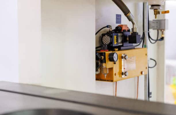 Automated fluid system inside a CNC machine used for medical part fabrication