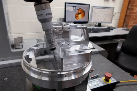 CMM touch probe inspecting dimensions of a CNC milled aluminum part for accuracy.