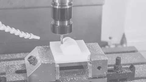 CNC machine cutting soft block with low tolerance requirement during prototyping.