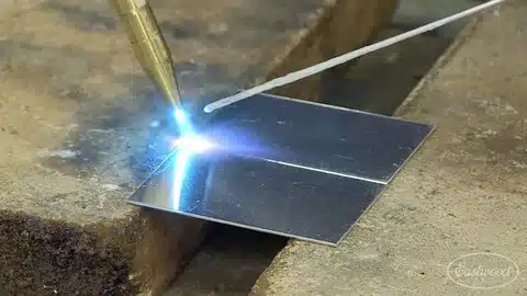 Oxy-acetylene torch gas welding a clean lap joint on thin sheet metal