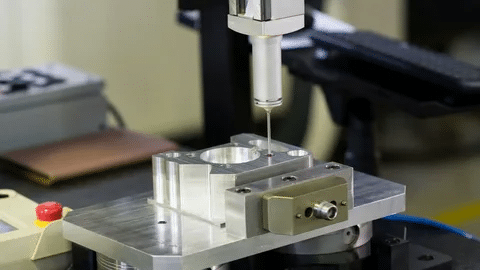 Probe tool measuring inner features of precision-machined part for tight tolerance compliance.