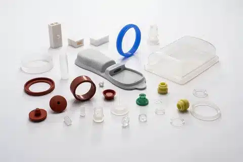 A variety of molded parts made from liquid silicone rubber in different colors and shapes