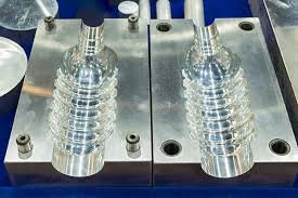 Aluminum mold used for plastic bottle production, showing tooling quality and factors influencing molding cost