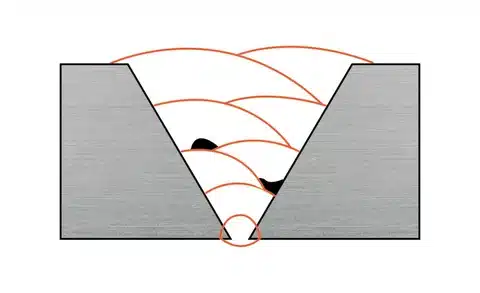 Section view of weld showing incomplete fusion between passes and joint walls