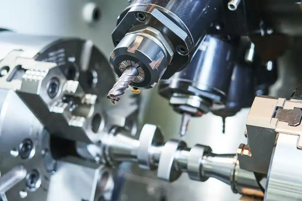 Multi-axis machining center equipped with rotating tool head and spindle for complex part production