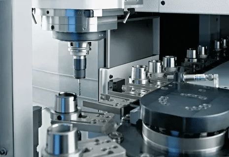 CNC machine with automated tool changer carousel and spindle in action