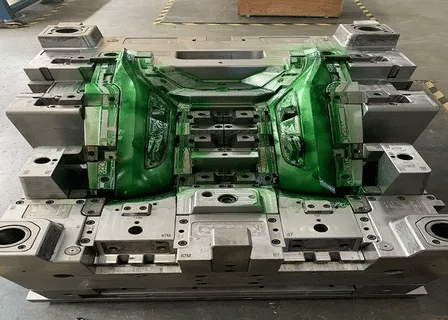 Automotive injection mold with high precision tolerance for plastic parts.