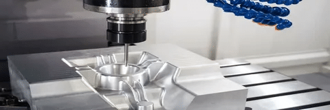 CNC milling machine cutting aluminum into custom part.