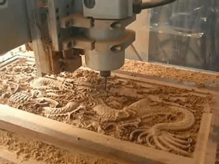 CNC router machine engraving wooden dragon designHigh-detail wooden engraving done using a CNC router machine.