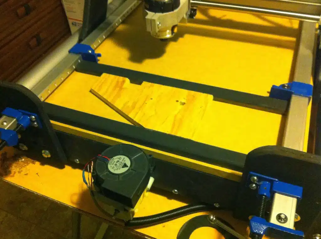 DIY CNC router using simple clamping method to fix wooden workpiece