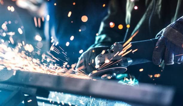 Sparks flying during metal grinding or cutting with an angle grinder