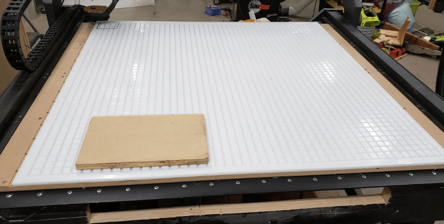 CNC vacuum table made with white HDPE plastic grid and smooth surface