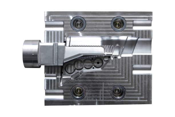 Precision-machined injection mold core and cavity tool with detailed features
