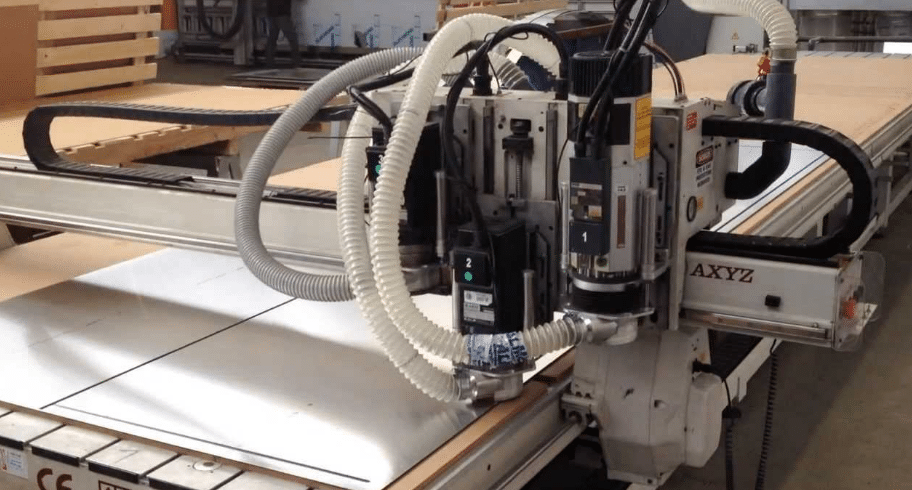Large industrial CNC router with vacuum hold-down system in operation