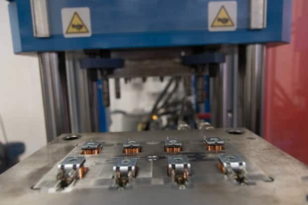 Insert mold loaded with metal parts ready for plastic injection process