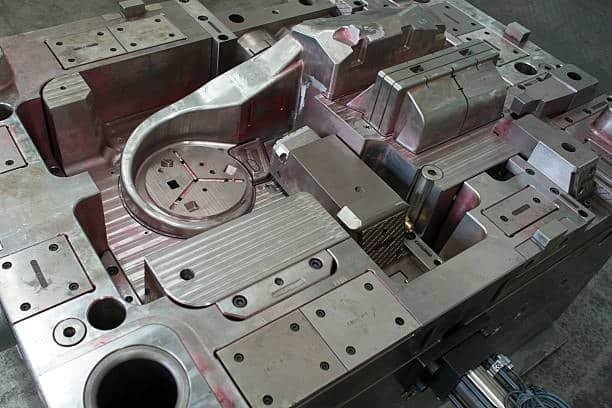 Full injection mold system with multiple cores and draft-angled part geometry