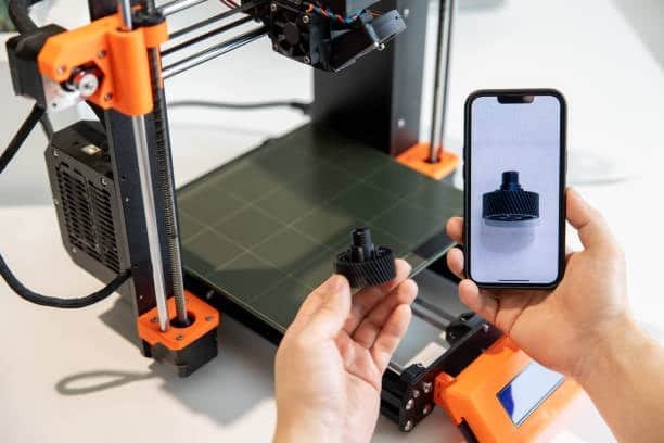 User scanning a 3D printed plastic gear using a smartphone for digital validation