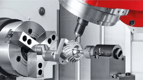 5-axis CNC machine cutting a helical gear with synchronized rotation