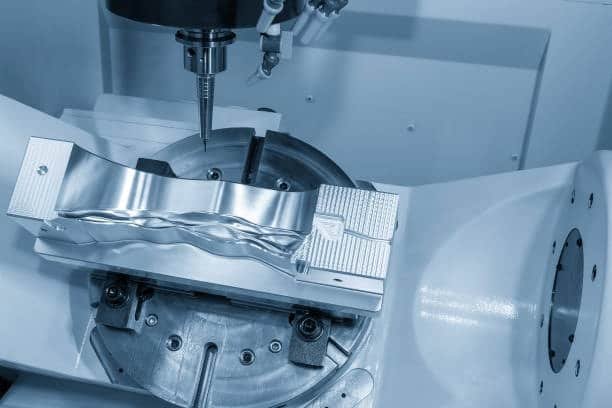 CNC machine using 5-axis motion to finish a complex mold cavity