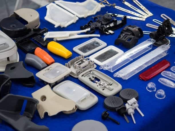 Various plastic components made using insert molding and overmolding techniques