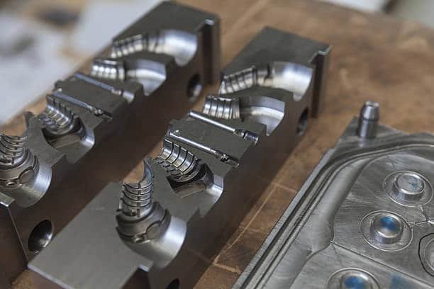 Precision-machined mold inserts with threaded part design and high-polish finish