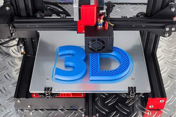 Purple 3D text being printed on a flat surface