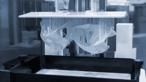 SLA 3D printer building complex plastic part with support structures