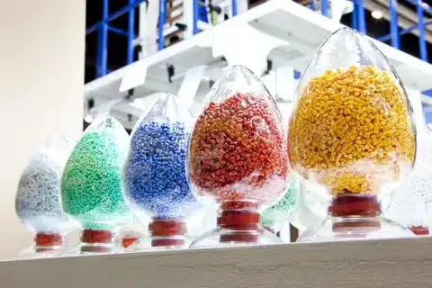Colored plastic polymer granules for plastic product manufacturing