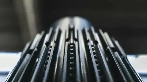 Close-up of black hard anodized aluminum profile used in industry.