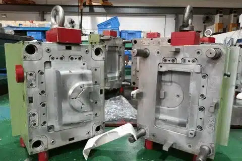 Opened injection mold with cavity and core parts used for producing plastic components.