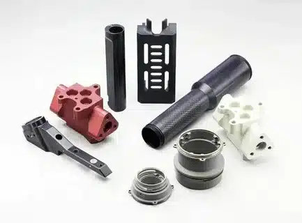 Different aluminum parts with hard anodized coating for industrial use.