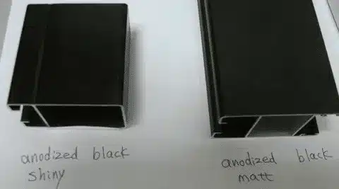 Side-by-side view of shiny vs matte black anodized aluminum profiles.