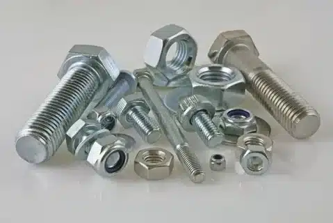 Collection of nuts and bolts in different sizes showing metric and standard designs